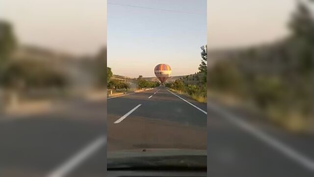 Hot air balloon in the middle of the road looks like a reenactment of the auto-refractor test we do at the eye doctor.